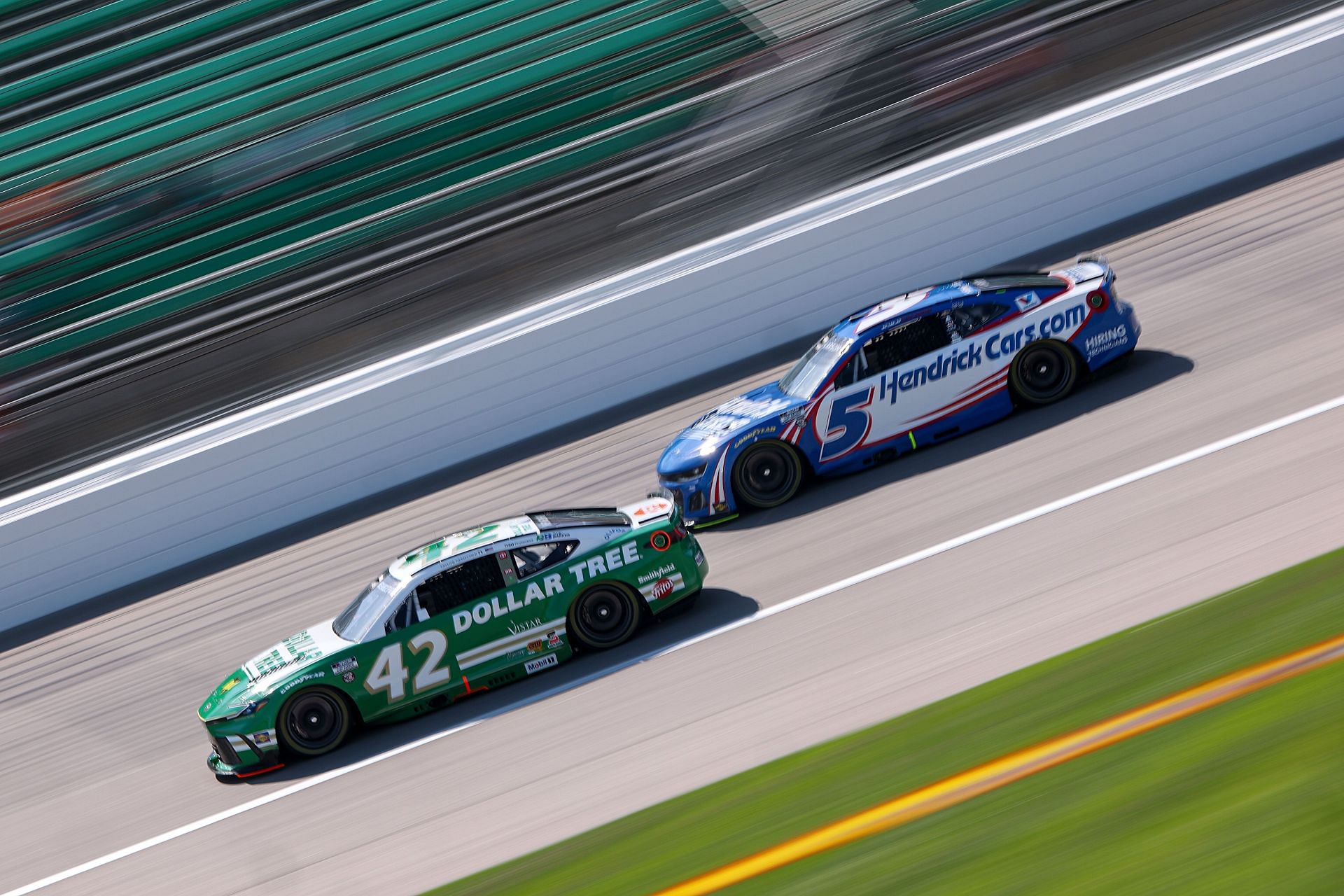 Kyle Larson (#5) behind the #42 Toyota of John Hunter Nemechek at Kansas Speedway - Source: Getty